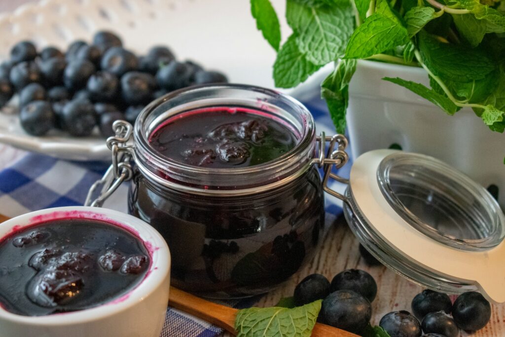 Squishing blueberries release dark red anthocyanin pigments which gives blueberry compote and other blueberry jams their luscious red colour
